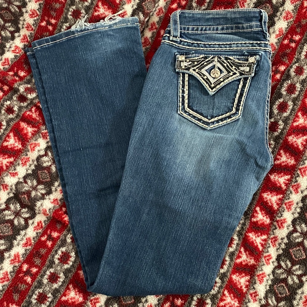 Selling my loved and worn Miss Me jeans.